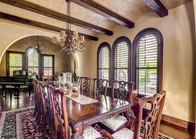 dining room with arched ceiling detail