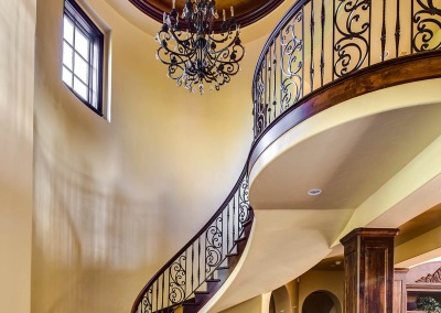 Curved Staircase and Chandeliers